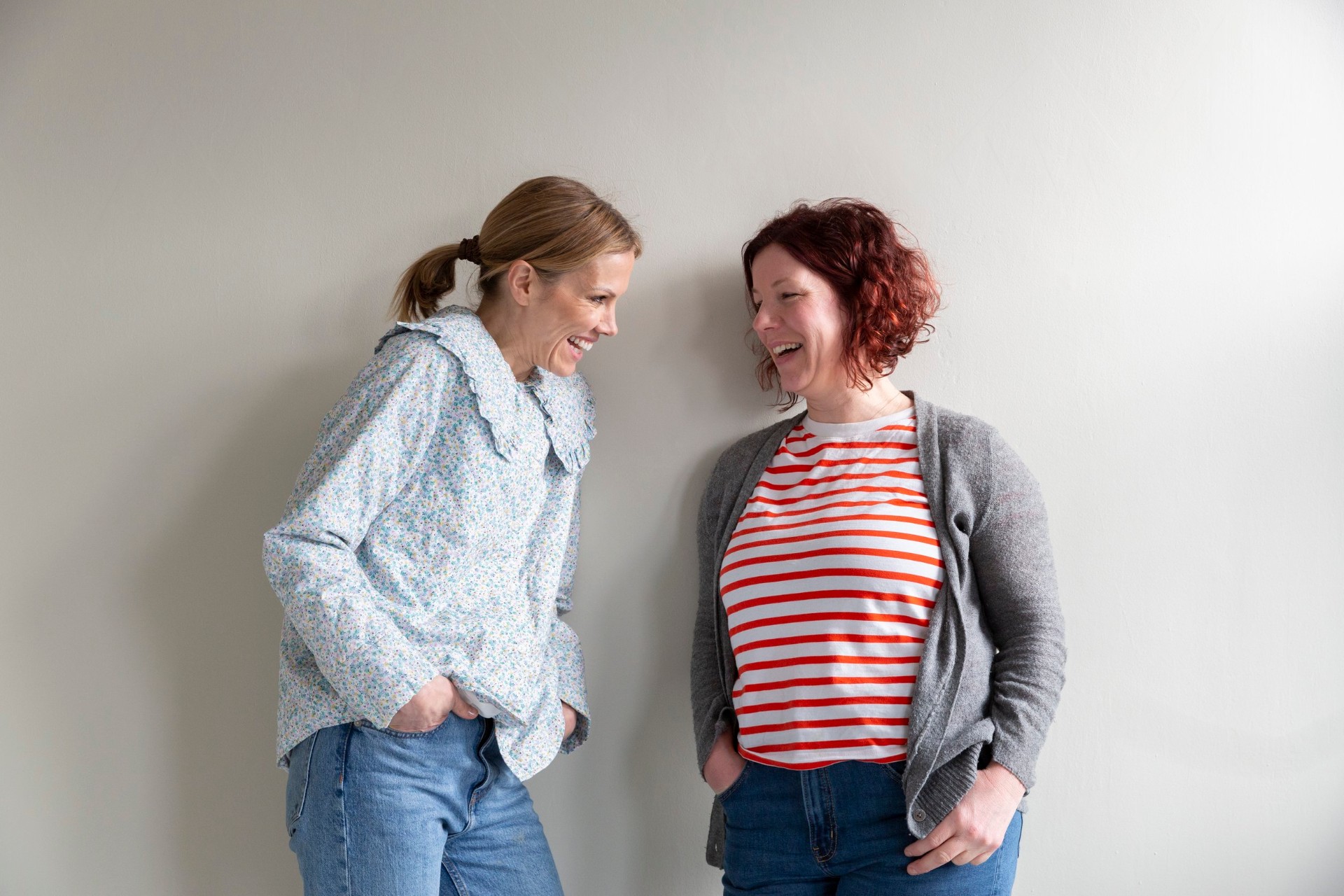 Five doulas from The Doula Club network standing together against a wall